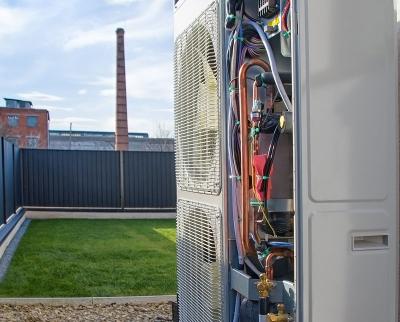 heat pump in property garden with cover off